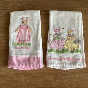 A set of two Kelly B. Rightsell baby girls bunny burp cloths